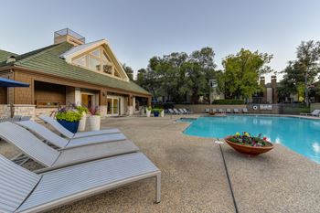 Swimming Pool with Lounge Chairs around the deck area.  This is one of three swimming pools on-site.at Folsom Ranch, Folsom, CA